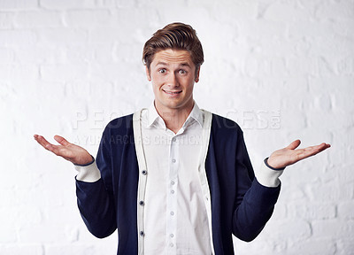 Buy stock photo Confused, shrug and portrait of man with doubt on wall background for choice, option and decision. Facial expression, thinking and isolated person with unsure, question and wonder reaction in studio