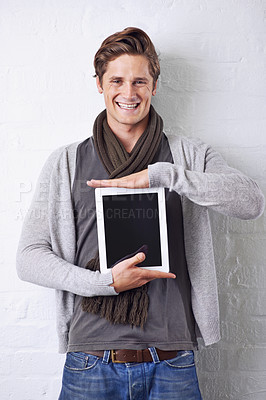 Buy stock photo Happy man, portrait and tablet screen for advertising or marketing on a white studio background. Face of young male person with smile and technology display in casual fashion for app or mockup space