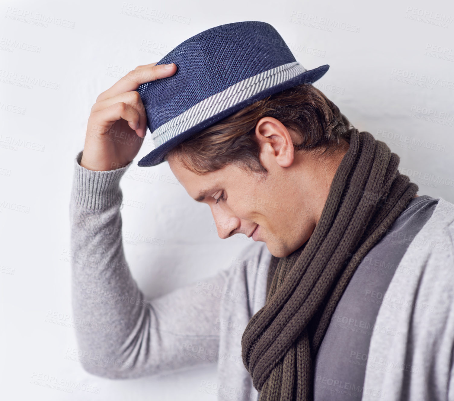 Buy stock photo Man, fashion and hat with confidence for style with wall background as hipster with scarf, clothes or relax. Male person, model and hand with smile in Canada for trendy headwear, cool or happiness