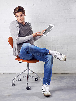 Buy stock photo A handsome young man showing you the latest digital tablet