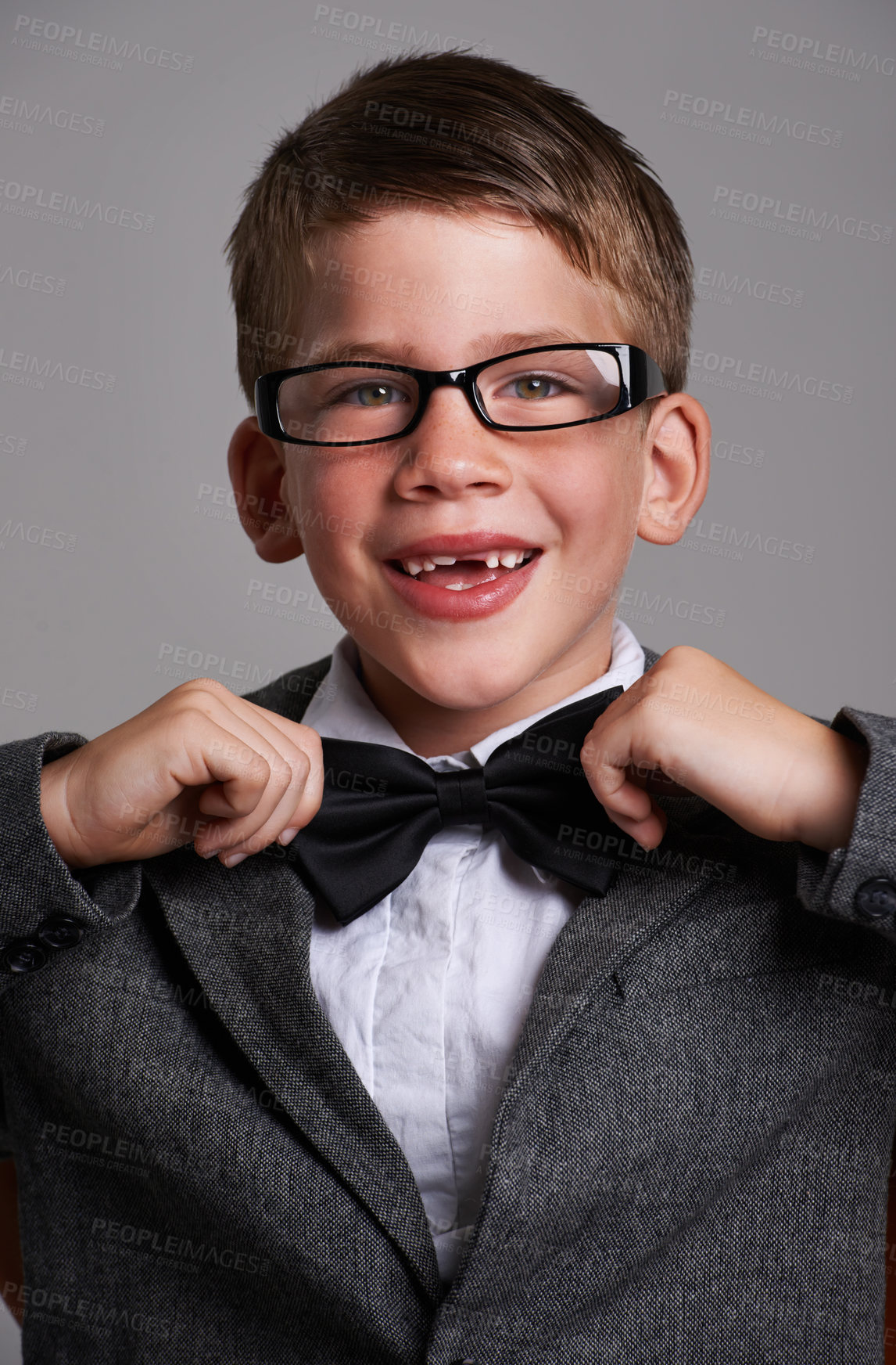 Buy stock photo Studio shot of a cute young boy wearing a retro suit against a grey background