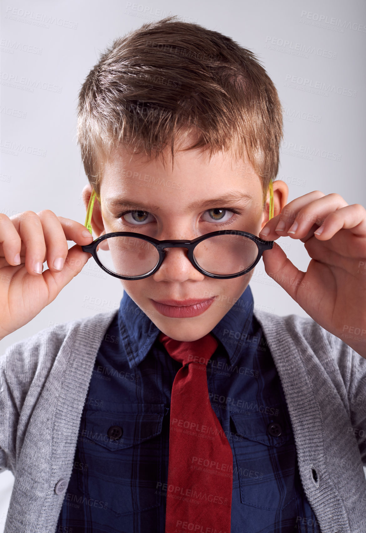 Buy stock photo Glasses, serious and portrait of child in studio for eye care, vision and optical health. Looking, optometry and young boy kid with stylish eyewear or spectacles isolated by white background.