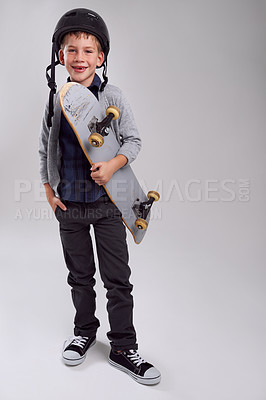 Buy stock photo Studio shot of a young skateboarder