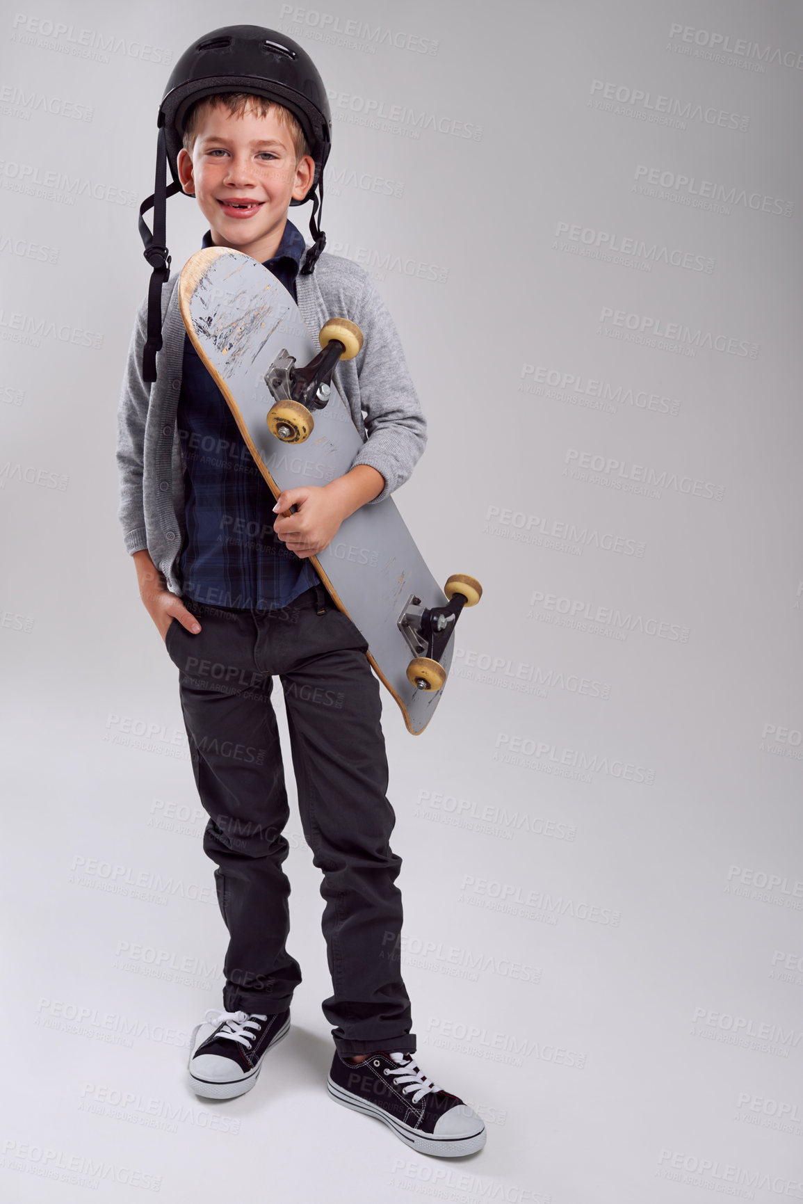 Buy stock photo Studio shot of a young skateboarder