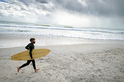 Buy stock photo Surfboard, running and man on beach for surfing on vacation, holiday and weekend in ocean. Relax, waves and person in wetsuit for water sports, hobby and exercise for adventure and freedom in sea