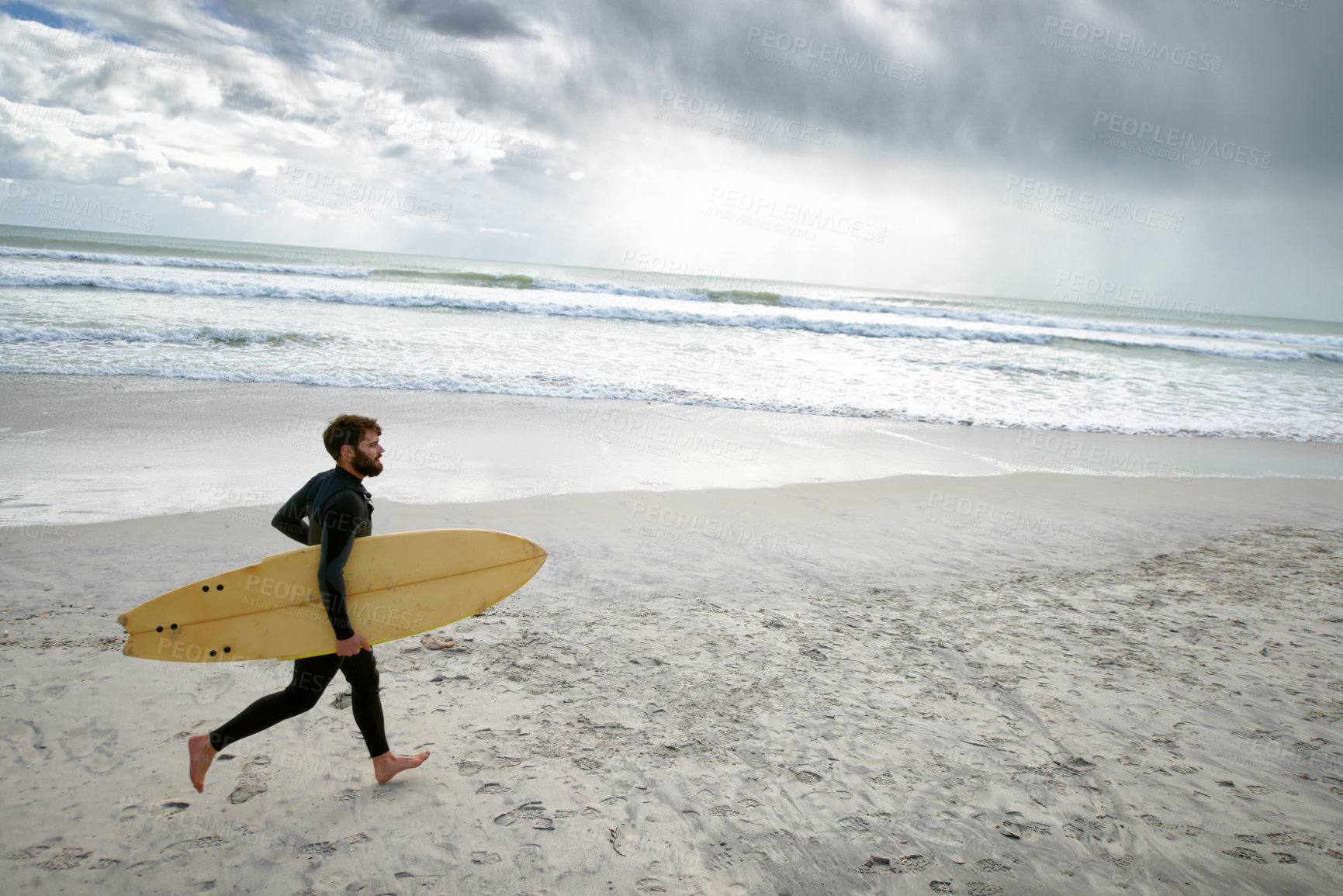 Buy stock photo Surfboard, running and man on beach for surfing on vacation, holiday and weekend in ocean. Relax, waves and person in wetsuit for water sports, hobby and exercise for adventure and freedom in sea