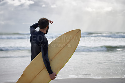 Buy stock photo A surfer with his surfboard at the beach