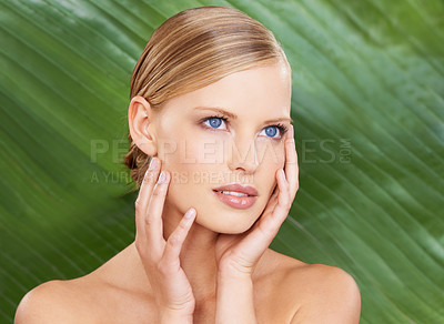 Buy stock photo Woman, thinking and skincare with leaf for beauty, detox and wellness for lifestyle. Female person, confident and hand on face with makeup for natural cosmetics, glow and routine for hydration
