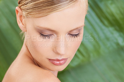 Buy stock photo Palm tree, skincare and woman with cosmetics, beauty and grooming with dermatology and glow. Person, natural treatment and girl with shine or leaf with wellness and nature with healthy skin or luxury