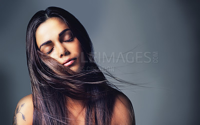 Buy stock photo Shot of a beautiful young woman in the studio