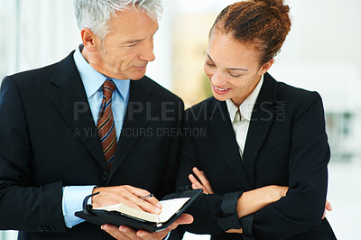 Buy stock photo CEO, showing and meeting with employee in office for business in corporate company for strategy. Woman, happy and talking to leader of workplace in professional with notebook for brainstorming