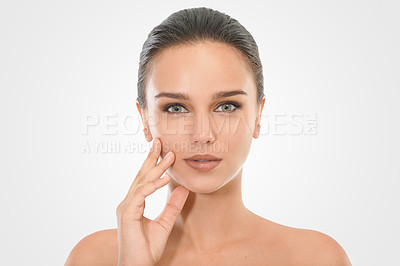 Buy stock photo Girl, skincare and hand on face in studio for beauty with natural look, cosmetics and dermatology for wellness. Woman, portrait and clean for self care, mockup and white background with serious model