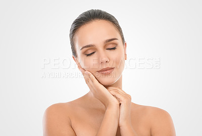 Buy stock photo Woman, skincare and hand on face in studio for natural beauty, glow and treatment on white background. Female person, smile and cosmetics with eyes closed for healthy, skin and wellness for lifestyle