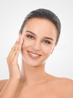 Buy stock photo Portrait, skincare and woman with smile in studio for beauty, dermatology or natural treatment. Happy, female person and hand on face for cosmetics, wellness and self care on white background