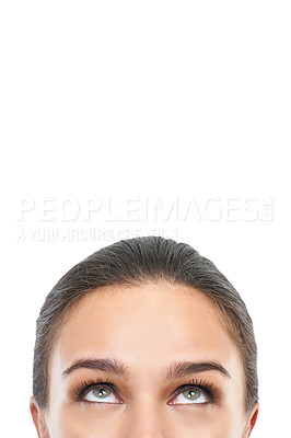 Buy stock photo Cropped image of a woman&#039;s face looking away against a white background