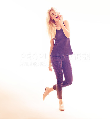 Buy stock photo Full length studio portrait of a lively fashionable young woman