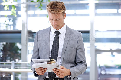 Buy stock photo Businessman, reading and newspaper in office for headlines, morning print and corporate information in accounting. Accountant, news and current affairs on global finance and analysis in workplace