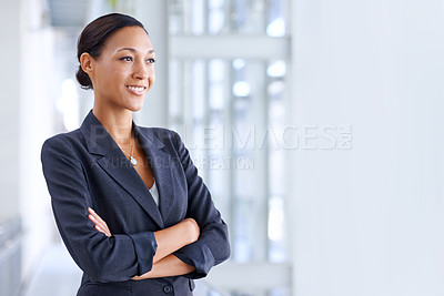 Buy stock photo A young businesswoman looking away thoughtfully