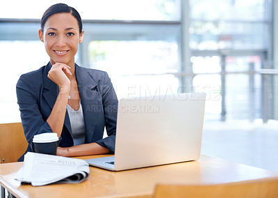 Buy stock photo An attractive businesswoman working on her laptop