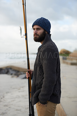 Buy stock photo Fishing, thinking and man at a beach for water hobby, recreation or stress relief in nature. Rod, waiting and male fisherman at the ocean for travel, journey or fish sports adventure in Cape Town