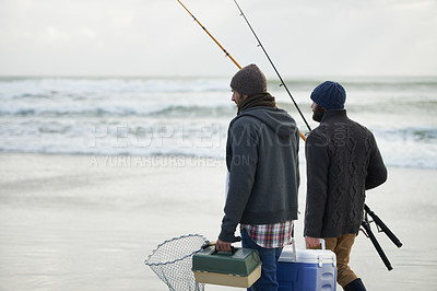 Buy stock photo Shot of a two friends going fishing on an early overcast morning