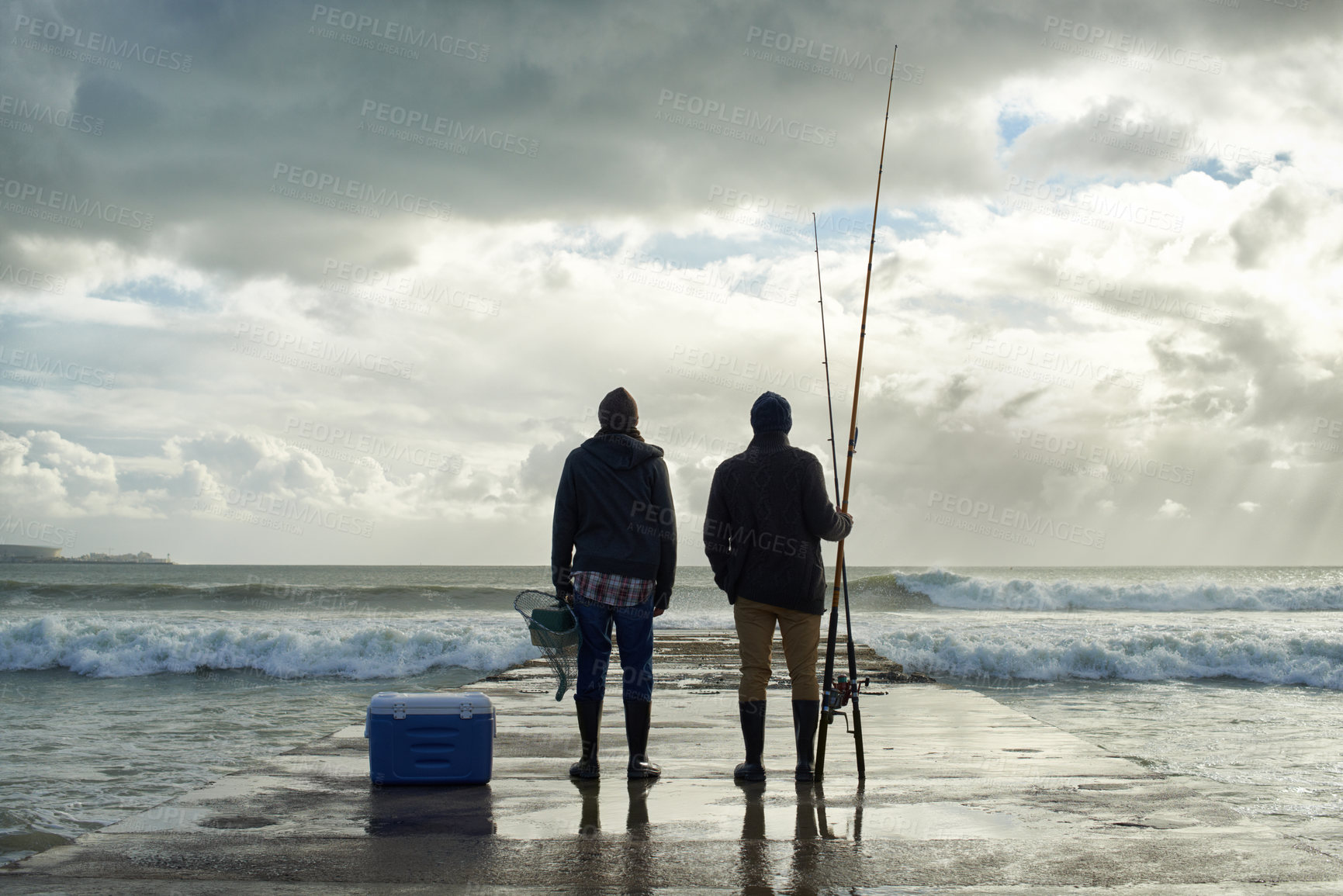 Buy stock photo Fishing, fisherman and back of friends on pier by ocean with rod, reel and equipment to catch fish for hobby. Nature, sports and men for bonding, fun and adventure on holiday, vacation and weekend