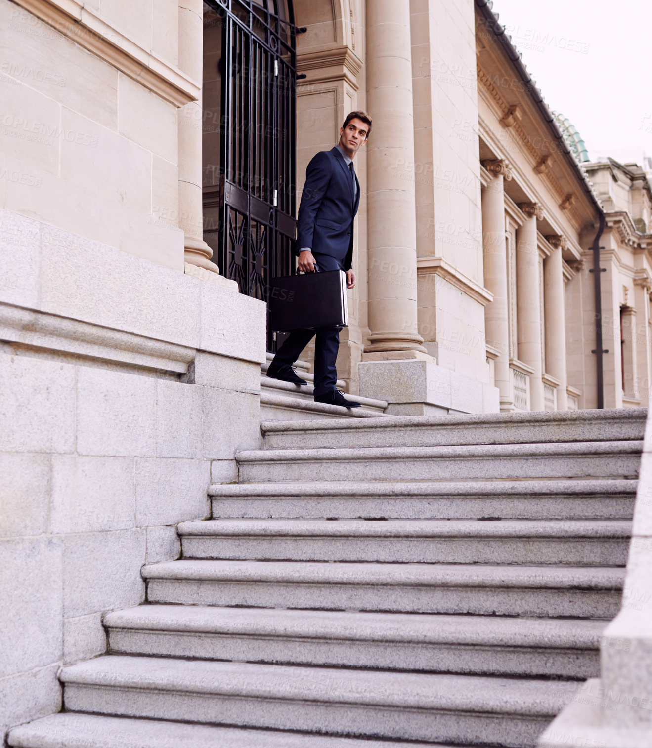 Buy stock photo Business, briefcase and man on stairs outside law firm in city with evening commute, checking sidewalk and court building. Businessman, lawyer or attorney on outdoor steps with bag for urban travel.