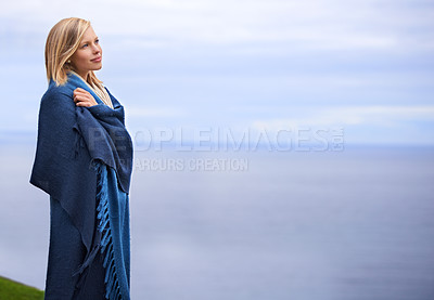 Buy stock photo Thinking, ocean and woman with blanket on mountain for adventure on holiday, vacation and weekend outdoors. Nature, travel and person by seaside for relaxing, happiness and peace in countryside
