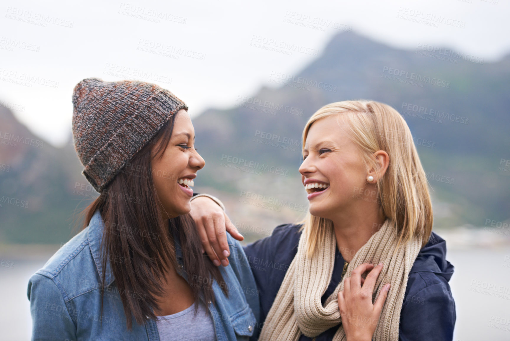 Buy stock photo Two happy young women smiling on the beach