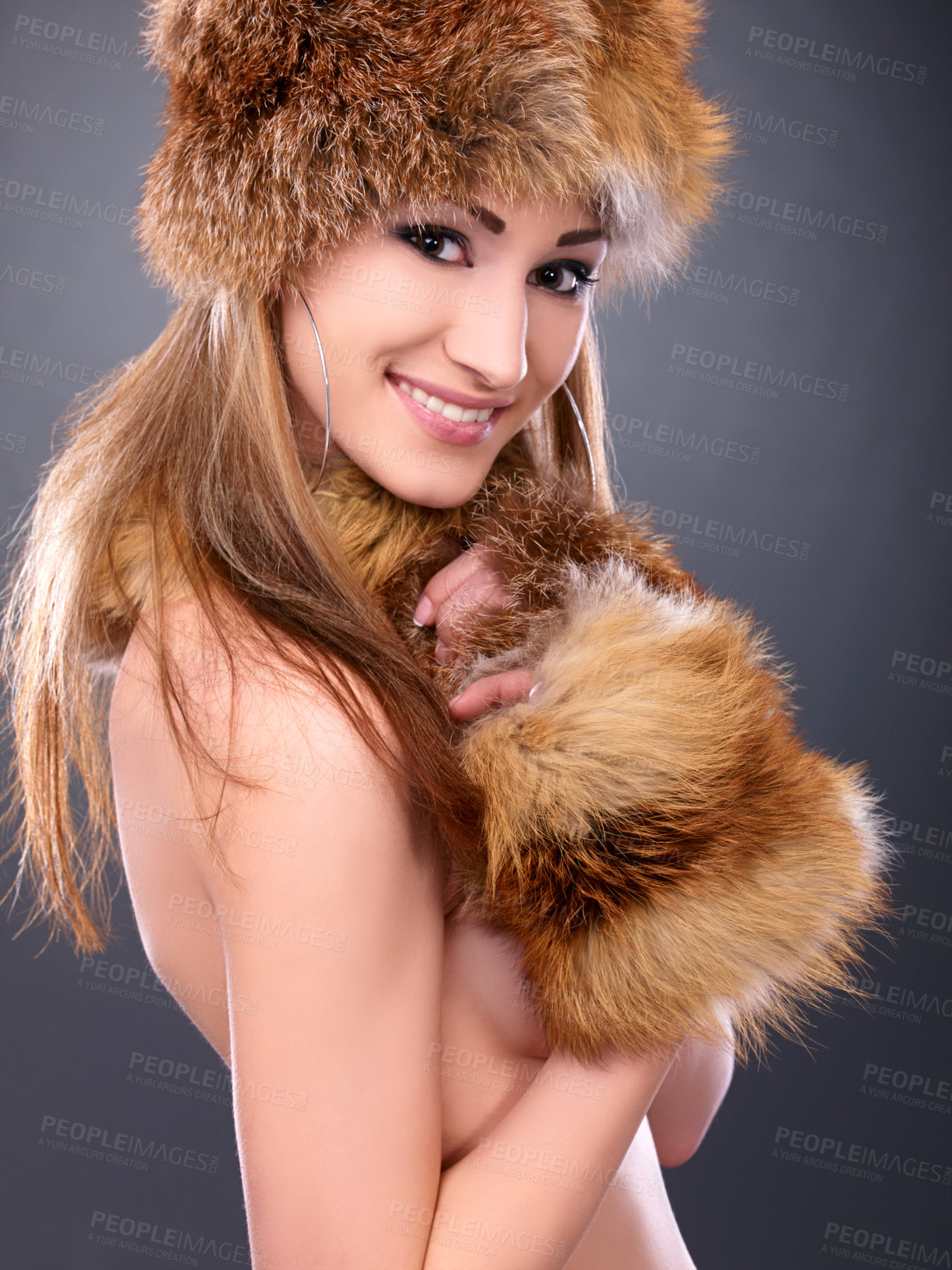 Buy stock photo Woman, portrait and hat with fur in studio for fashion, aesthetic and naked with happiness or confidence. Model, person and face with winter style, smile and pride or shirtless on black background