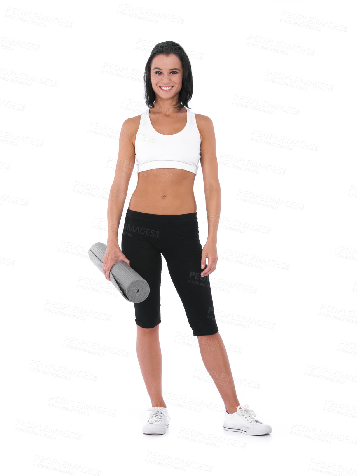 Buy stock photo A healthy young woman smiling while holding a yoga mat - Isolated on white