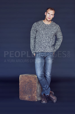Buy stock photo Fashion, casual and portrait of a man in a studio with a trendy, stylish and winter outfit. Serious, confidence and full body of a young male model with a fancy style isolated by a blue background.