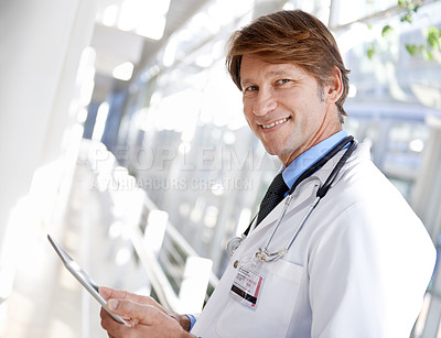 Buy stock photo Smile, tablet and portrait of doctor in hospital reading medical chart for diagnosis or treatment. Happy, digital technology and male healthcare worker with documents in medicare clinic corridor.