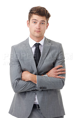 Buy stock photo Portrait, serious and arms crossed with business man in studio isolated on white background for review. Company, corporate and mission with young human resources employee in suit for feedback