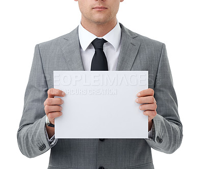 Buy stock photo Hands, poster and marketing with business man in studio isolated on white background for closeup advertising. Corporate, mock up and space for information with employee holding sign or placard