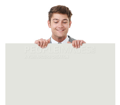 Buy stock photo Smile, poster and space with business man in studio isolated on white background for advertising or marketing, Billboard, mockup and promotion with happy young person holding banner for information