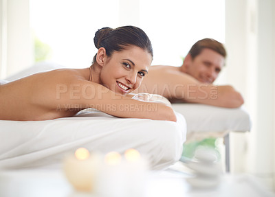 Buy stock photo Woman, portrait and massage bed in spa for peace, treatment and bodycare for therapy. Couple self care, happy and luxury for wellness, relax and calm people at resort for beauty and zen with face