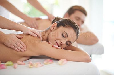 Buy stock photo Couple, massage and relax in luxury spa with treatment on body for wellness on holiday or vacation. Beauty, care and calm people together in hotel, salon or resort for healthy skincare on back