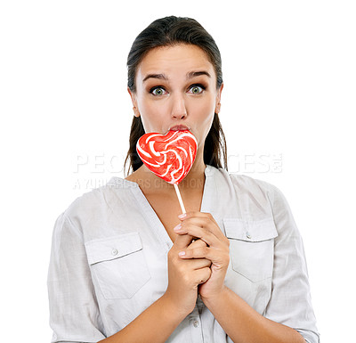 Buy stock photo Candy, portrait and happy woman with a lollipop in a studio for a sweets craving, dessert or sugar. Happiness, snack and young female model eating heart shape sweet while isolated by white background