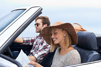 Buy stock photo Map, driving and couple in a car for travel to vacation, adventure or holiday destination. Happy, navigation guide and young man and woman on journey in vehicle for weekend road trip together.