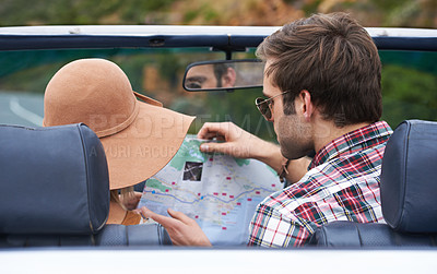 Buy stock photo Map, travel and back of couple in a car for driving to vacation, adventure or holiday destination. Reading, navigation guide and young people on journey in vehicle for weekend road trip together.