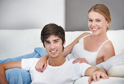 Buy stock photo Couple, living room and lying with sofa, portrait and lounge for relaxation and love or smile. People, home and romance for comfortable valentines day date and happiness for bonding and relationship