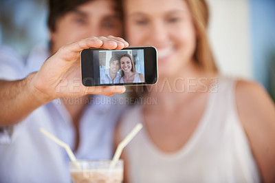 Buy stock photo Couple, phone screen and photography for blog, date and time or milkshake on valentines day memories. Man, woman and selfie outdoor, capture and moment for weekend getaway and romantic vlog 