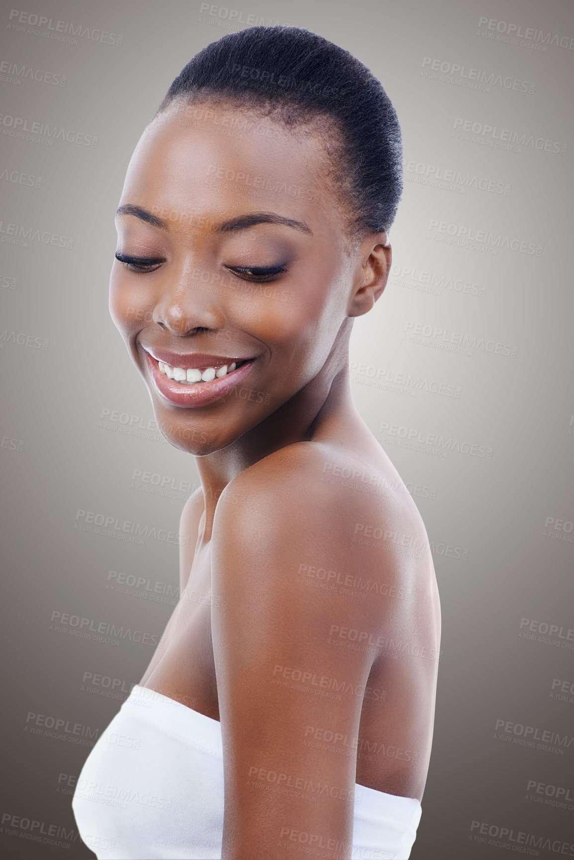 Buy stock photo Skincare, dermatology and face of black woman in studio with smile, natural makeup or facial glow. Cosmetics, relax or beauty of happy girl on grey background for healthy skin care, shine or wellness