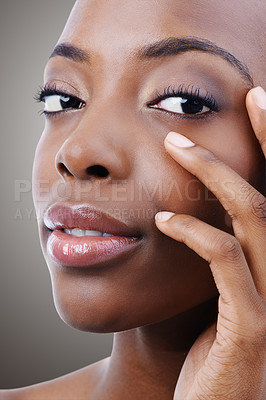 Buy stock photo Skincare, beauty and portrait of black woman on gray background for wellness, cosmetics and makeup. Dermatology, salon and person touch face for aesthetic, confidence and facial treatment in studio