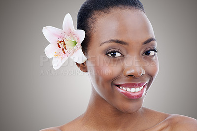 Buy stock photo Portrait, smile for skincare and black woman with flower in studio on gray background for natural beauty. Face, wellness or spa and happy young person with orchid plant for aesthetic cosmetics