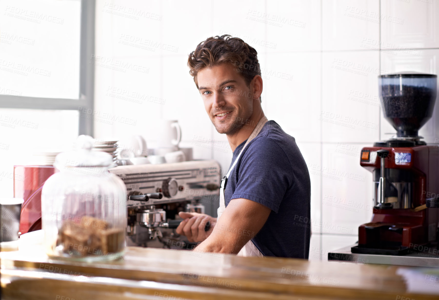 Buy stock photo Portrait of a young male barista in a coffee shop