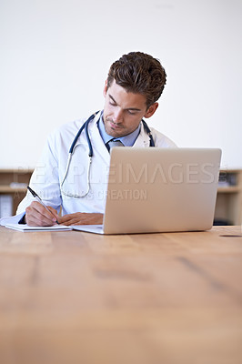 Buy stock photo Doctor, laptop and notebook for writing at desk for medical research, schedule or patient report in office. Man, technology and pen on paper for results, planning or health insurance in hospital