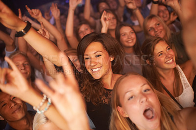 Buy stock photo Fans, audience and people at concert, music festival and band performance with happy energy while dancing at celebration for new years. Women crowd excited and crazy at event for live show at club