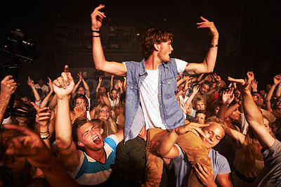 Buy stock photo Shot of a large crowd at a music concert
